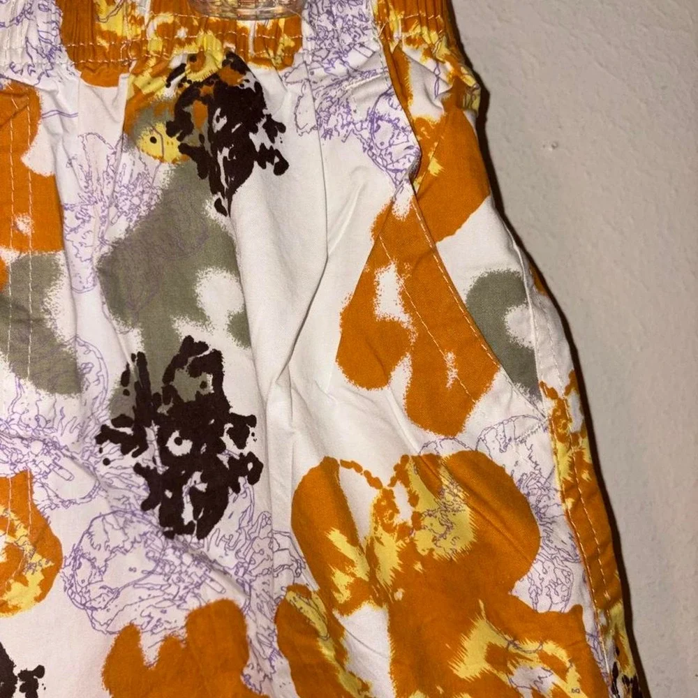 Swim Shorts Orange, black, and purple floral print swim trunks #swimwear #floral